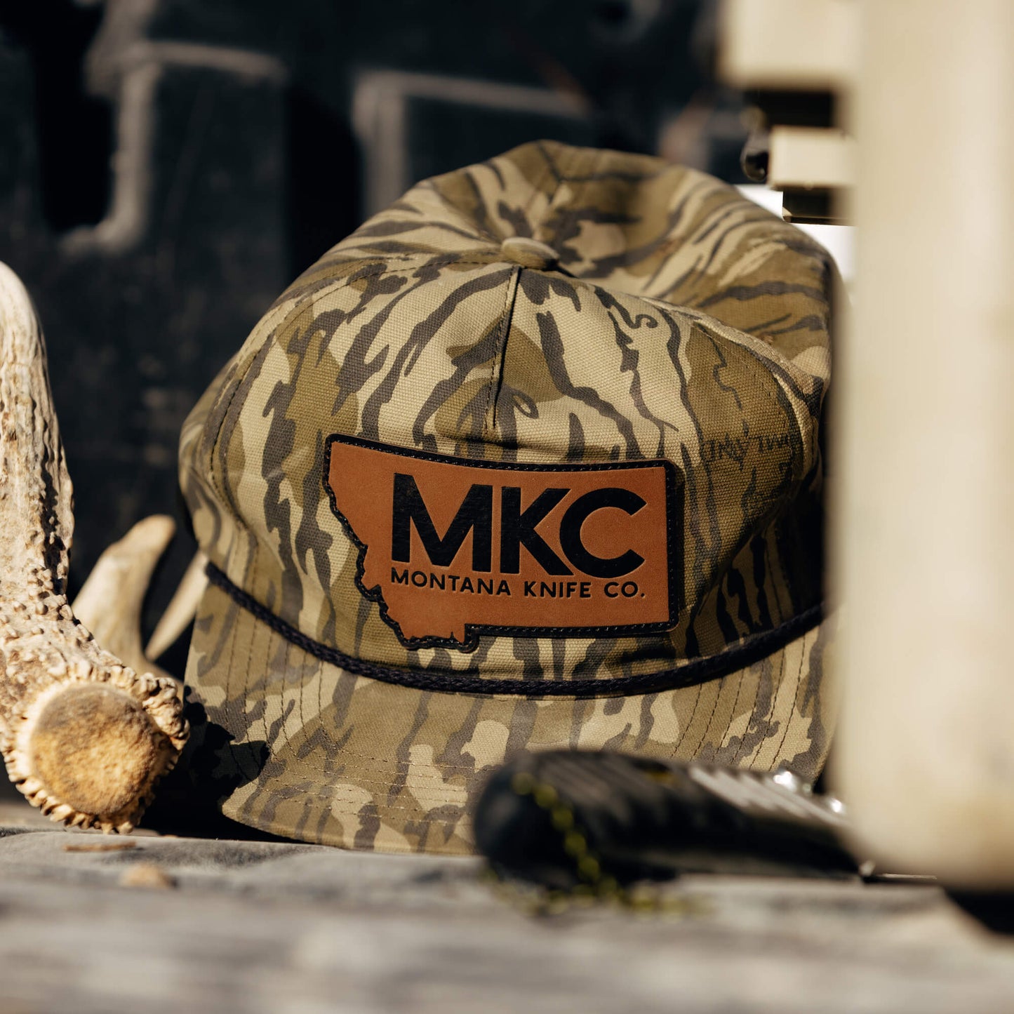 MKC X MOSSY OAK ROPE HAT - BOTTOMLAND